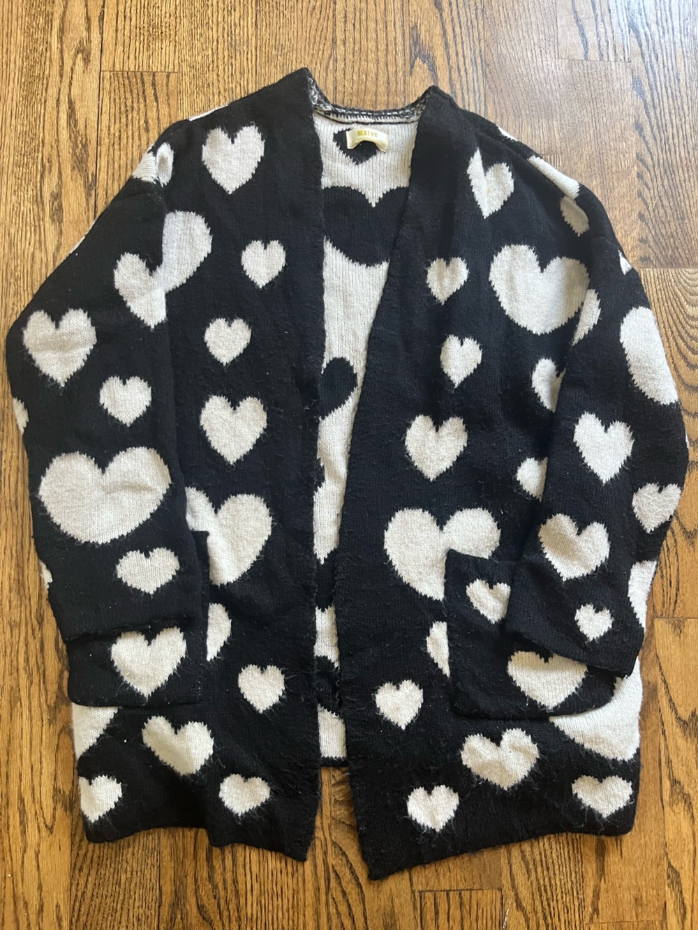 Anthropologie black and white heart open cardigan.